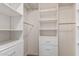 Well-organized walk-in closet with white shelving, drawers, and hanging rods at 2018 E Avenida Del Sol --, Phoenix, AZ 85024