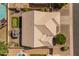 Detailed aerial view highlighting the backyard putting green, the covered patio, and a refreshing swimming pool at 21335 N 64Th Ave, Glendale, AZ 85308