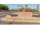 Charming community sign with lush landscaping, creating a welcoming entrance at 21335 N 64Th Ave, Glendale, AZ 85308