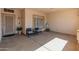 Cozy covered front porch with seating, a secure front door, and views of the manicured front yard at 21335 N 64Th Ave, Glendale, AZ 85308