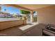 Inviting covered front porch offering a shaded seating area and a view of the well-maintained neighborhood at 21335 N 64Th Ave, Glendale, AZ 85308