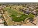 Aerial view of the community's manicured golf course surrounded by beautiful homes and lush landscaping at 21335 N 64Th Ave, Glendale, AZ 85308
