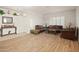 Elegant living room with hardwood floors, warm lighting, and views of the entry at 21335 N 64Th Ave, Glendale, AZ 85308