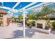 Beautiful desert backyard featuring a fireplace and lounge area for relaxation and entertaining at 22633 N Clubhouse Way, Scottsdale, AZ 85255
