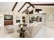 Bright living room with high ceilings, fireplace, and open access to the backyard through sliding glass doors at 22633 N Clubhouse Way, Scottsdale, AZ 85255