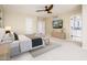Spacious main bedroom with large windows, ceiling fan, walk-in closet, and an ensuite bathroom at 22633 N Clubhouse Way, Scottsdale, AZ 85255