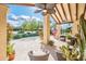Charming outdoor patio with comfortable seating and a beautiful view of the landscaped garden and blue skies at 22633 N Clubhouse Way, Scottsdale, AZ 85255