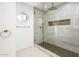 Contemporary glass shower with designer tile accents and mosaic tile flooring at 22633 N Clubhouse Way, Scottsdale, AZ 85255