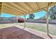 View of brick back porch and a large backyard with garden, perfect for entertaining at 2419 W Shady Glen Ave, Phoenix, AZ 85023