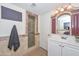 A stylish bathroom with a decorative mirror and stand up shower at 2419 W Shady Glen Ave, Phoenix, AZ 85023