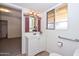 A bathroom with a stylish vanity and decorative mirror at 2419 W Shady Glen Ave, Phoenix, AZ 85023
