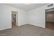 A bright bedroom with neutral carpeting at 2419 W Shady Glen Ave, Phoenix, AZ 85023