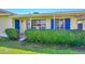 Close up of a single-story home featuring blue shutters and well-maintained landscaping at 2419 W Shady Glen Ave, Phoenix, AZ 85023