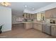 Kitchen area showcases updated stainless steel appliances and natural light pouring in from the window at 2419 W Shady Glen Ave, Phoenix, AZ 85023