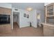 Kitchen nook with views to the hall and bathroom boasts wood-look flooring and white wainscoting at 2419 W Shady Glen Ave, Phoenix, AZ 85023
