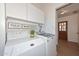 Laundry room with side by side washer and dryer and storage at 2419 W Shady Glen Ave, Phoenix, AZ 85023