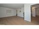 Inviting living room with light hardwood floors and neutral paint provides a serene and spacious atmosphere at 2419 W Shady Glen Ave, Phoenix, AZ 85023
