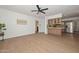 Spacious living room boasts wood-look flooring and stainless steel appliances at 2419 W Shady Glen Ave, Phoenix, AZ 85023