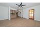 An expansive living room with wood-look flooring and a dark ceiling fan at 2419 W Shady Glen Ave, Phoenix, AZ 85023