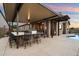 Backyard features an outdoor kitchen, covered patio, and pool for backyard fun at 24280 N 164Th Dr, Surprise, AZ 85387