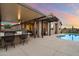 Home with a private backyard with a covered outdoor kitchen and a sparkling pool at 24280 N 164Th Dr, Surprise, AZ 85387