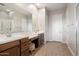 Bright bathroom features double vanity, wood cabinets, plank flooring, and a separate toilet and shower room at 24280 N 164Th Dr, Surprise, AZ 85387