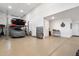 Spacious garage featuring car lift and storage cabinets for the car enthusiast at 24280 N 164Th Dr, Surprise, AZ 85387
