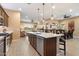 Open-concept layout connects the kitchen to the living area, creating a seamless space for entertaining and daily living at 24280 N 164Th Dr, Surprise, AZ 85387