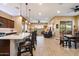 This open-concept kitchen flows into a spacious living area with tile floors and lots of natural light at 24280 N 164Th Dr, Surprise, AZ 85387