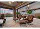 Outdoor patio area complete with comfortable seating and a built-in barbecue area at 24280 N 164Th Dr, Surprise, AZ 85387