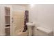 Full bathroom with a shower stall, a pedestal sink, and a toilet at 2445 W Yuma St, Phoenix, AZ 85009