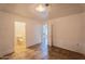 Bedroom featuring tile flooring, white walls, and an attached bathroom at 2445 W Yuma St, Phoenix, AZ 85009