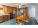 An eat-in kitchen features natural wood cabinets and stainless steel refrigerator at 2445 W Yuma St, Phoenix, AZ 85009