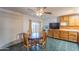 Eat-in kitchen featuring a ceiling fan and natural wood cabinets at 2445 W Yuma St, Phoenix, AZ 85009