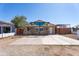 Charming home with a stone facade, a red roof, and a large concrete parking pad at 2445 W Yuma St, Phoenix, AZ 85009