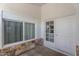 Covered front porch with double doors and a large window, perfect for relaxing at 2445 W Yuma St, Phoenix, AZ 85009