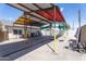Large covered parking area with yellow support poles at 2445 W Yuma St, Phoenix, AZ 85009