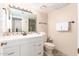 Well-lit bathroom with a white vanity, tiled backsplash, and a standard toilet at 2524 S El Paradiso -- # 122, Mesa, AZ 85202