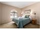 Inviting bedroom filled with natural light, featuring a bed and two matching nightstands at 2524 S El Paradiso -- # 122, Mesa, AZ 85202