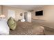 Serene bedroom with a comfortable bed, a flatscreen TV, and lots of natural light at 2524 S El Paradiso -- # 122, Mesa, AZ 85202