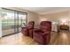 Relaxing bedroom featuring plush recliners, water view, and comfortable bed at 2524 S El Paradiso -- # 122, Mesa, AZ 85202