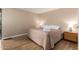 Serene bedroom with a comfortable bed, wood floors, and simple decor at 2524 S El Paradiso -- # 122, Mesa, AZ 85202