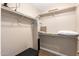 Walk-in closet with built-in shelving and ample storage space; perfect for organizing at 2524 S El Paradiso -- # 122, Mesa, AZ 85202