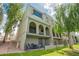 Inviting condo exterior with a fenced patio and upper level balconies at 2524 S El Paradiso -- # 122, Mesa, AZ 85202