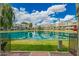 Beautiful lake view surrounded by lush lawns and condo buildings at 2524 S El Paradiso -- # 122, Mesa, AZ 85202