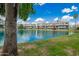 Scenic lake view of condos, mature trees, and lush landscaping at 2524 S El Paradiso -- # 122, Mesa, AZ 85202