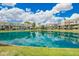 Condos overlook the community lake with mature landscaping at 2524 S El Paradiso -- # 122, Mesa, AZ 85202