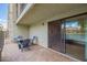 Inviting patio with table and chairs, perfect for enjoying the lake view at 2524 S El Paradiso -- # 122, Mesa, AZ 85202