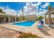Relaxing community pool with lounge chairs and shaded seating areas at 2524 S El Paradiso -- # 122, Mesa, AZ 85202