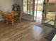 Dining area adjacent to the kitchen and sliding glass door to the backyard pool at 2649 N 85Th Ave, Phoenix, AZ 85037